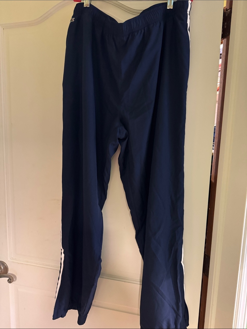 Lacoste Navy Track Pants with White Side Stripes and Red Logo
